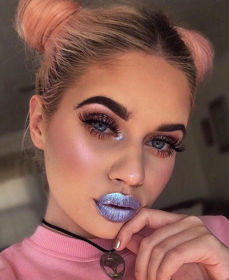 An image of a woman with a silver coloured lipstick