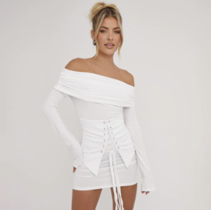 blonde lady wearing a white corset detail fold over mini dress