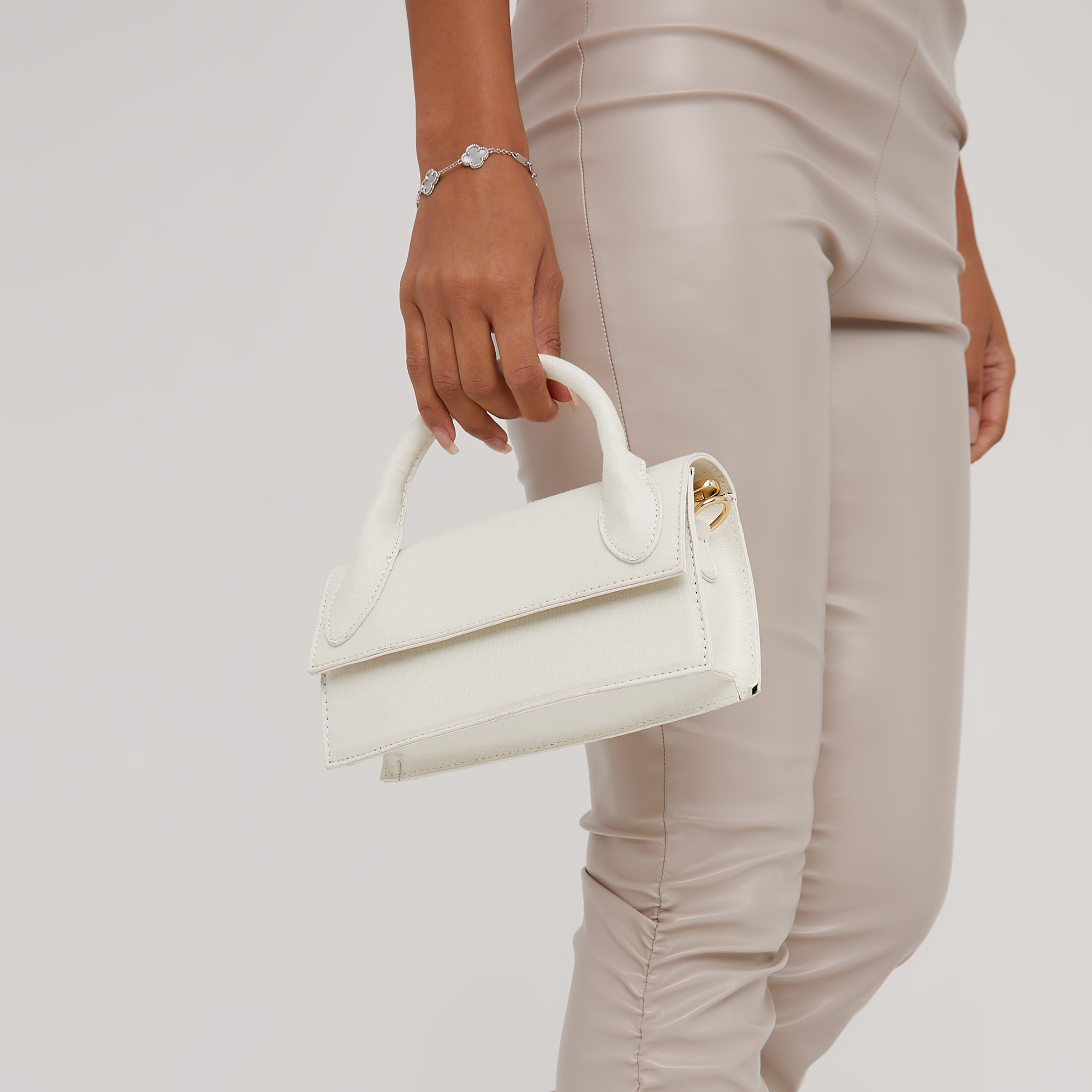 Linden Embossed Detail Oversized Clutch Bag In Cream Faux Leather