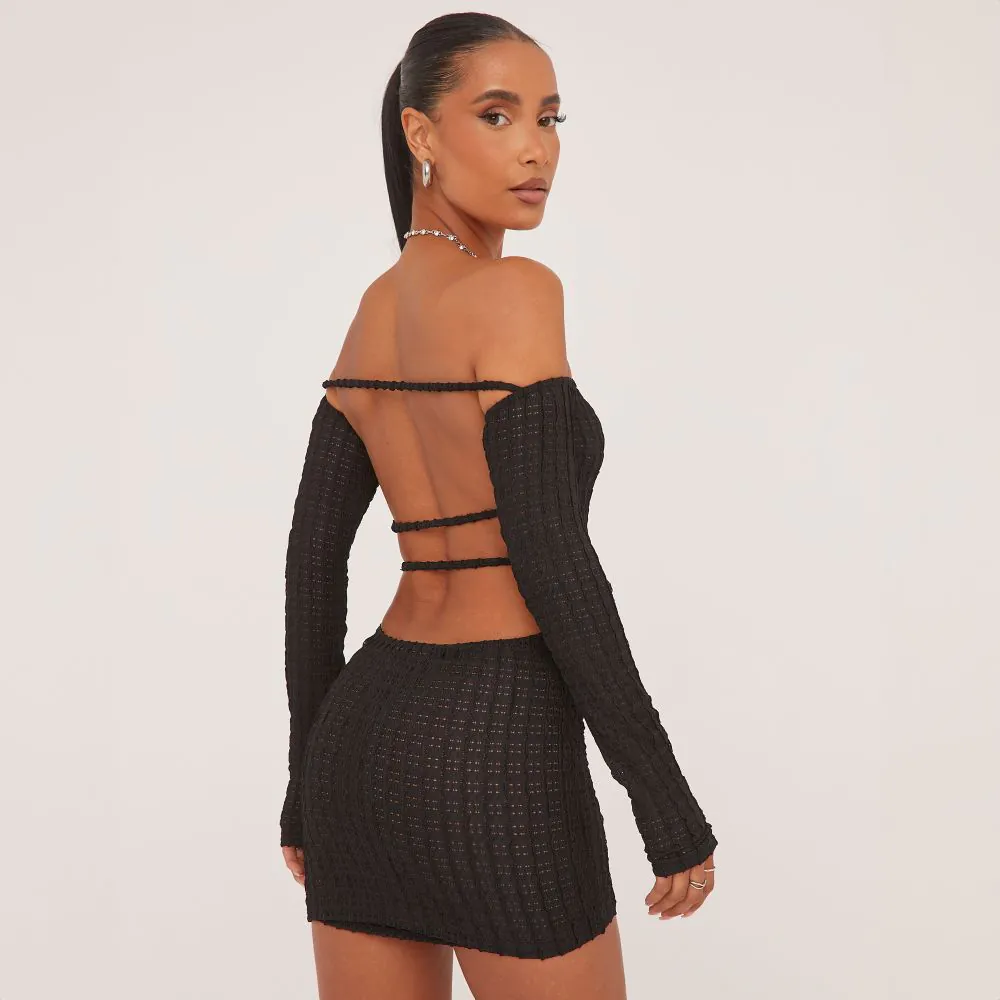  Skip to the end of the images gallery Skip to the beginning of the images gallery BARDOT STRAPPY BACK MINI BODYCON DRESS IN BLACK TEXTURE